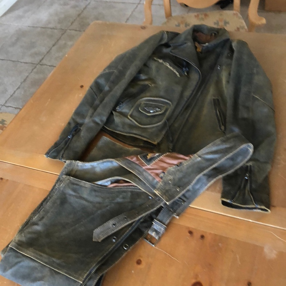 HD woman’s  distressed leather jacket and chaps.